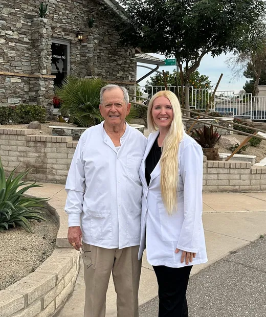 Dr. Robert Holyoak and Dr. Lisa Kubik outside the Copper Sky Dental office in Peoria, AZ