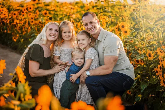 Dr. Lisa Kubik with her husband Chad and their children Olivia, Caroline, and Christian in an Arizona sunflower field