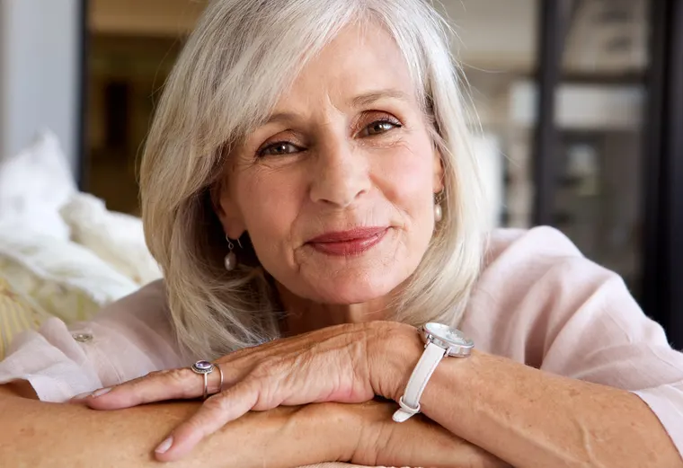 A calm, comfortable senior woman at ease after care, the relief that prompt emergency dental treatment brings, at Copper Sky Dental in Peoria, AZ