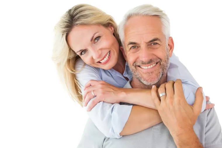 A happy mature couple smiling together, the kind of healthy smiles routine general dentistry helps maintain, at Copper Sky Dental in Peoria, AZ