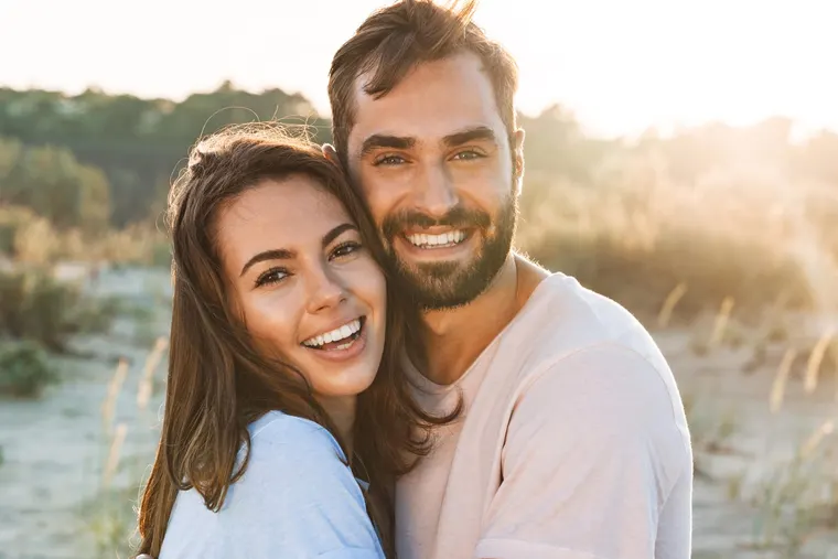 A happy couple with straight, confident smiles, the kind of result Invisalign clear aligners deliver for adults, at Copper Sky Dental in Peoria, AZ