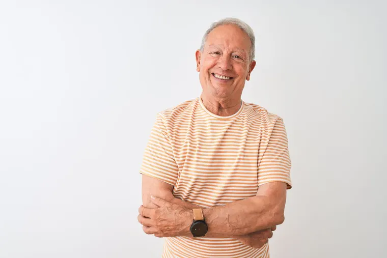 A smiling senior man with healthy gums and a confident smile, the result periodontal care helps protect, at Copper Sky Dental in Peoria, AZ